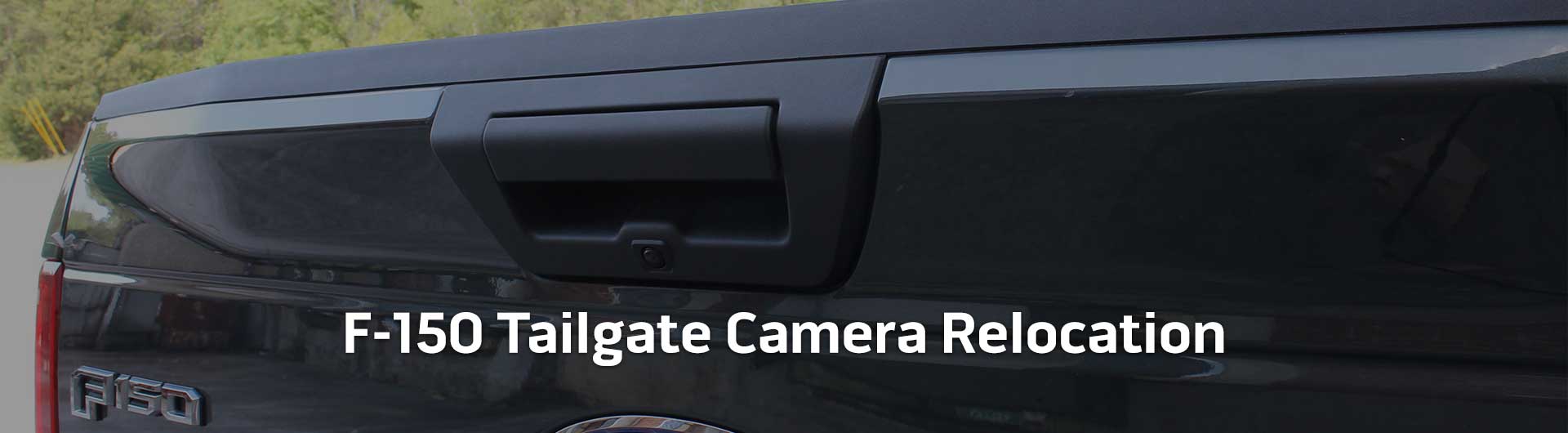 An image showing the in-dash monitor of a Ford truck. The in-dash monitor shows that the truck is in reverse and is displaying both the backup camera and video from the cameras on the front and side of the truck. The image has text that reads Ford Trucks Tailgate Camera Relocation.