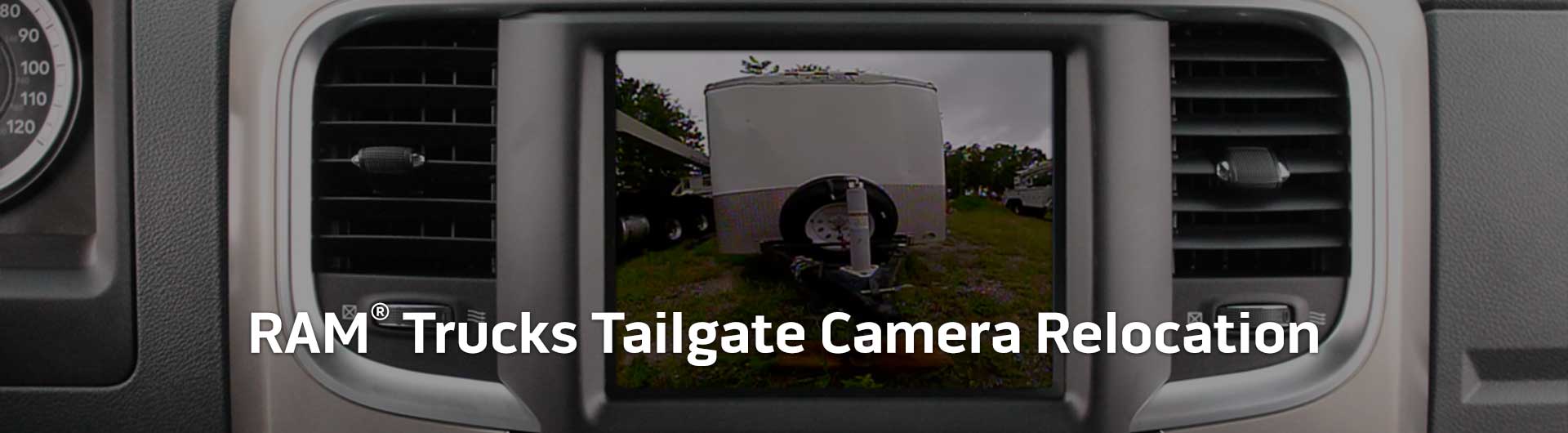 An image showing the in-dash monitor of a RAM truck. The in-dash monitor shows that the truck is in reverse and is displaying both the backup camera and video from the cameras on the front and side of the truck. The image has text that reads RAM Trucks Tailgate Camera Relocation.